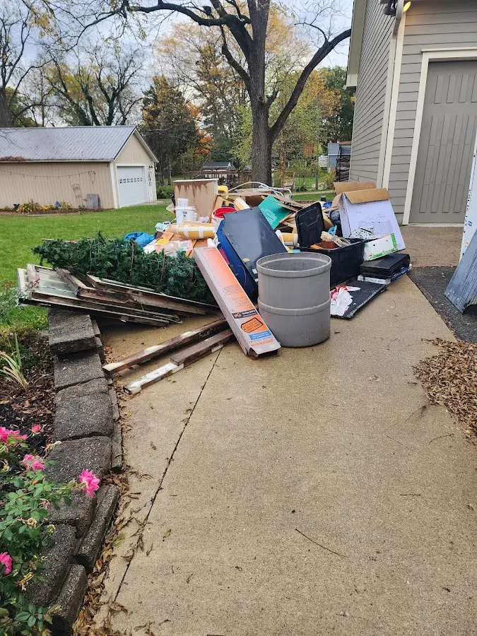 Dumpster being loaded with debris for Commercial Dumpster Rental in Bridgeport